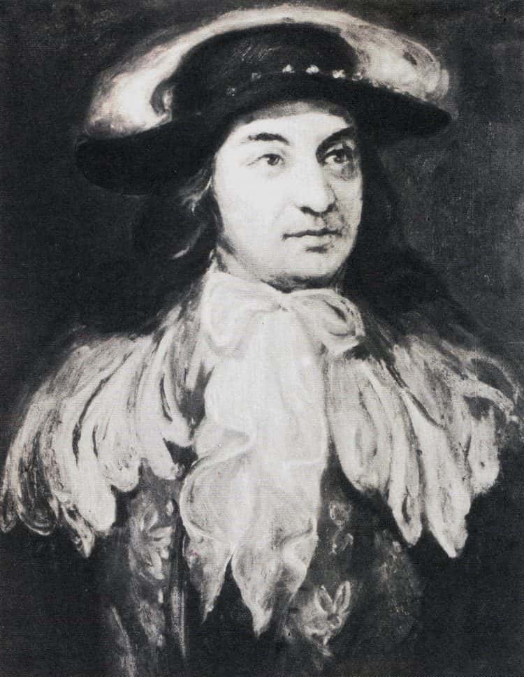 Painted portrait of a man in a long wig and 18th century coat, turned three quarters to the viewer