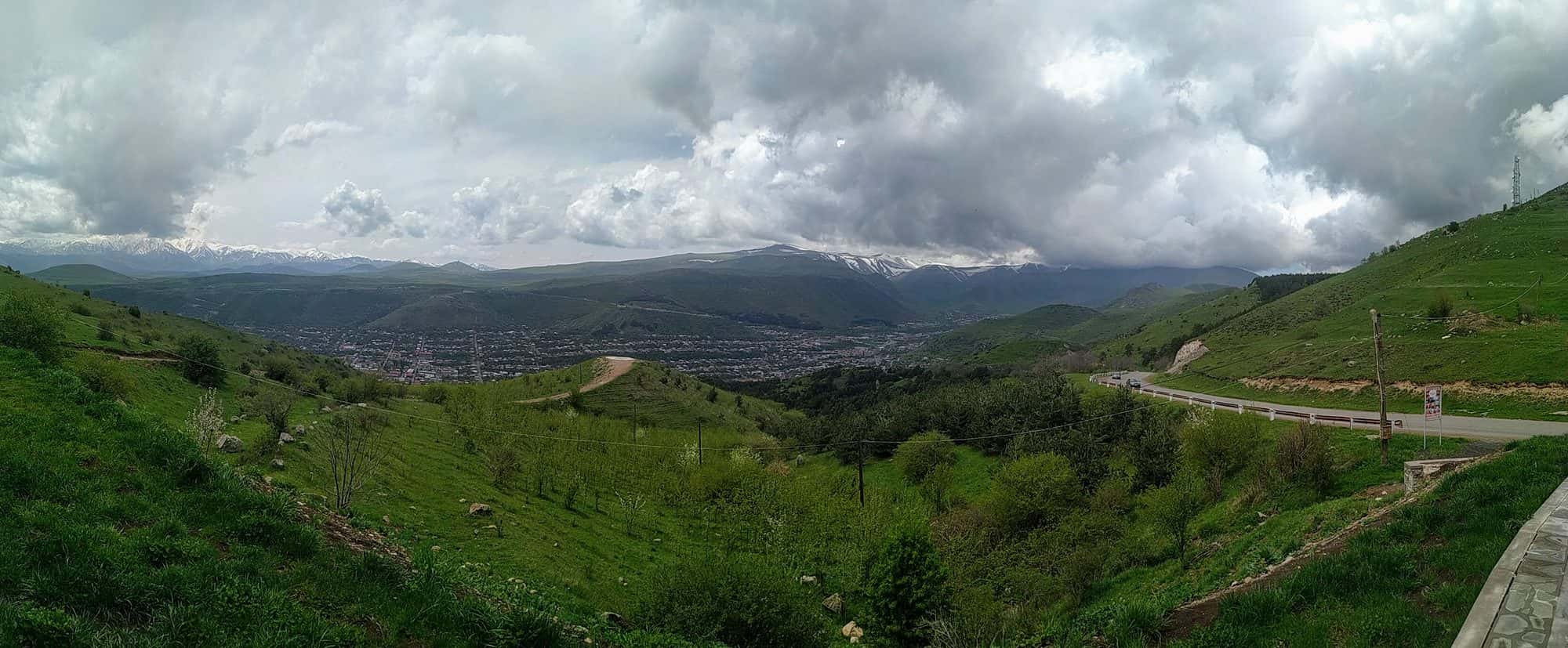 Panoramic view of forested mountain ridges seen from the winding road between Goris and Berdzor